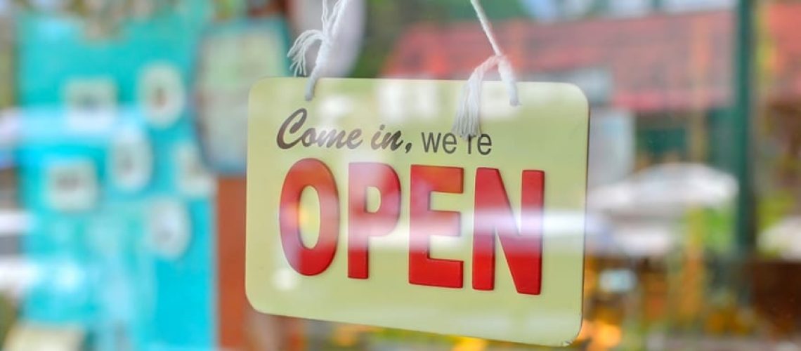open-sign-through-glass-shop-front